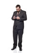 © David Gilder - businessman looking down using a gadget in his hands
