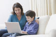 © REB Images/Blend Images - Hispanic mother and son using laptop