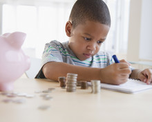 African American Boy Counting Coins