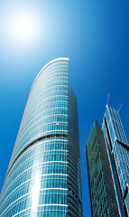 Wall Mural - modern glass business center in sunny day