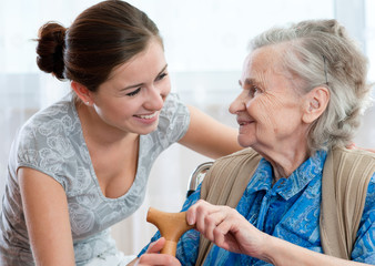 Wall Mural - Senior woman with her home caregiver