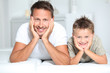 © goodluz - Closeup of father and son at home