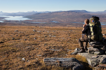 Wall Mural - hiker takes a break in lapland