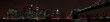 Panoramic New York City skyline from the Brooklyn at night.