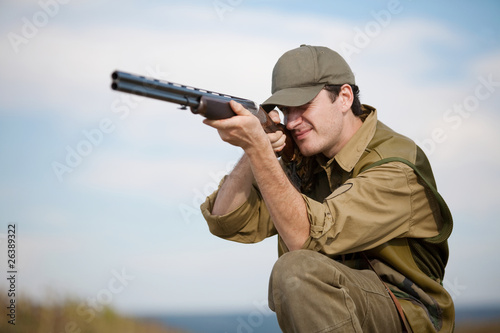Fotografie, Obraz Hunter aiming at the hunt during a hunting party