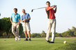 © Monkey Business - Group Of Male Golfers Teeing Off On Golf Course