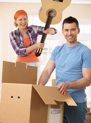 Poster - Woman pretending to attack man with guitar