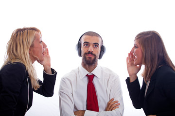 Businessman with Ear Protectors between Two Screaming Woman