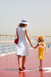 © Pavel Losevsky - young mother and daughter walking on cruise liner deck