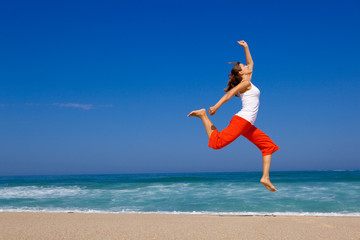 Wall Mural - Young woman jumping