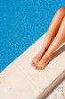 © FrankBoston - Female legs by the pool
