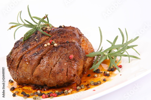 Fotografie, Obraz Roast pork with rosemary and some colorful peppercorns