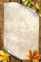 Old Paper With Autumn Leaves On Wood