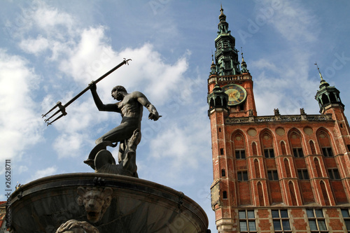 Fototapeta na wymiar Fountain of the Neptune and city hall in Gdansk - Poland