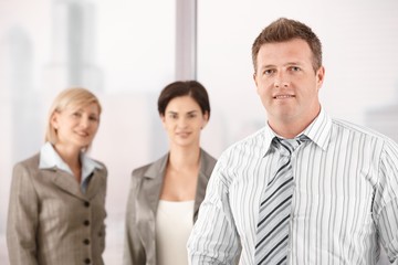 Wall Mural - Businessman with female coworkers