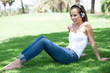 © get4net - Young woman listening to music and relaxing