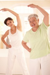 Canvas Print - Elderly woman with personal fitness trainer