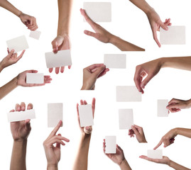 Collection of card blanks in a hand on white background