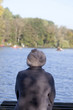 © D. Ott - young woman sitting on a pier and watching the lake