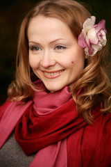 Happy young woman with flower