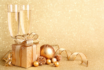 Poster - Golden gift box with glasses of champagne