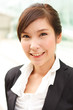 © DAZOKA.com - Bright closeup portrait of asian business woman