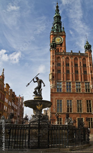 Fototapeta na wymiar Fountain of the Neptune and city hall in Gdansk - Poland