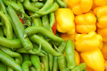 Wall Mural - close up of yellow and green peppers