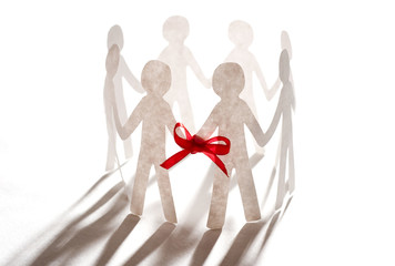 paper team linked together with red bow