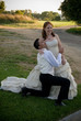 © Ansunette - just married couple kneeling smiling and playing outside
