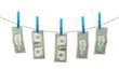 US Dollar's Hanging on Rope with Clothespins isolated background