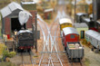 trains in a miniature model freight yard