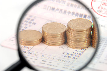 Poster - Magnifier and coins on bankbook