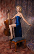 Woman in evening dress posing with cello
