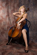 Attractive woman in evening dress with cello