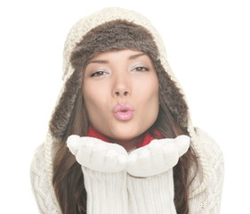 Wall Mural - Beautiful winter woman blowing kiss isolated