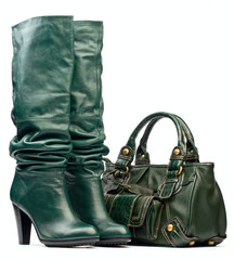 Wall Mural - Green female high-heeled boots and leather bag