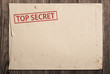 Open top secret envelope on table.