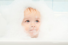Cute Adorable Baby Play With Foam In Bath