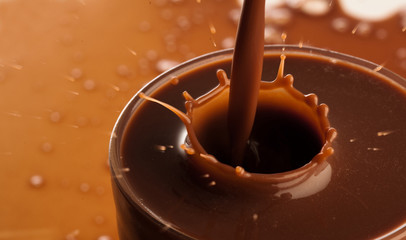 Wall Mural - pouring chocolate on glass