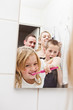© gemenacom - Family brushing teeths