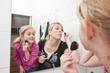 © gemenacom - Mother and Daughter put on make-up
