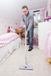 © gemenacom - Man with a vacuum cleaner