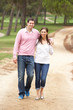© Monkey Business - Romantic couple enjoying walk in park
