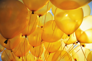 inflatable yellow helium balloons party background