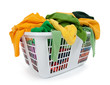 Bright clothes in laundry basket. Green, yellow.