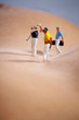 © ZoomTeam - Miniature Figures playing golf on naked woman body