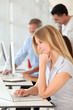 © goodluz - Beautiful woman working in the office on laptop computer