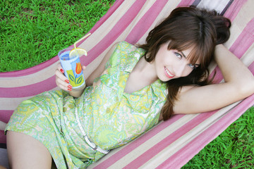 beautiful girl relaxing in the hammock