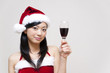 © taka - a portrait of santa girl taking a red wine